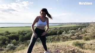 A sexy girl is having fun with her coach outdoors