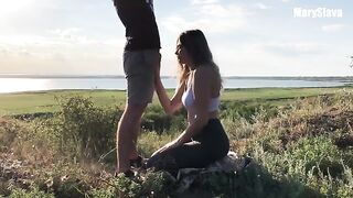 A sexy girl is having fun with her coach outdoors