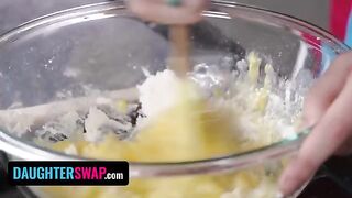 Two stepdaughters are making a pie while engaging in some playful antics