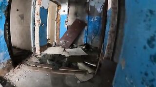 An exhibitionist girl walks through abandoned buildings in a daring act
