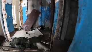 An exhibitionist girl walks through abandoned buildings in a daring act