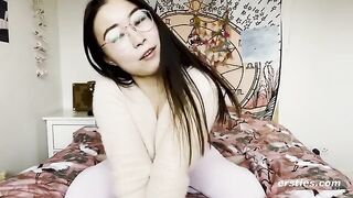 A small-breasted Chinese girl masturbates passionately on camera
