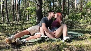A passionate couple has a picnic in the park and makes love