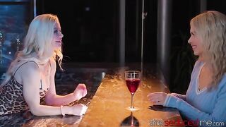 The girl is being served a drink by a hot lesbian bartender