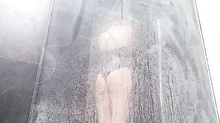 A hot woman plays with her pussy in the shower and squirts