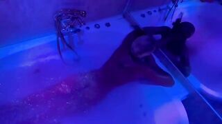 A blonde woman has sex in the bathroom with a big toy