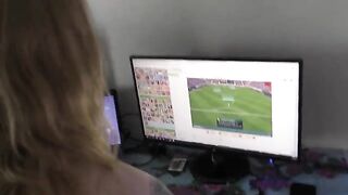 A girl with a big ass plays video games at home
