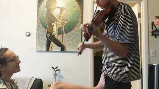 Trying to practice violin with my girlfriend, passionate action