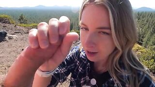 A woman gave a blowjob on the mountain top riskily