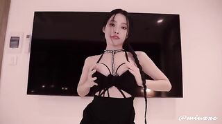 Hot Asian chick in a black dress, wearing high heels, squirts and gets cum inside her