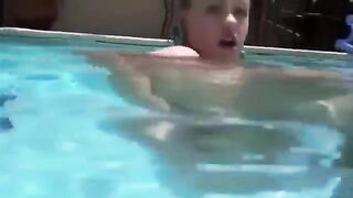 Girl has anal sex using a dildo while in the water