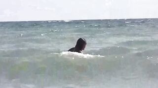 Girls are getting a tan on the naked beach
