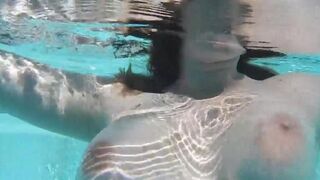 Fella masturbates with dildo in the swimming pool