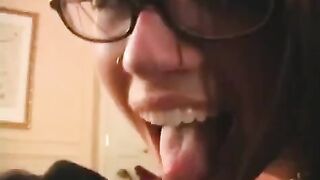 The fool is happy in glasses, getting a member sucked