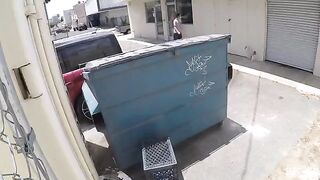 The couple was photographed having sex behind the garbage tank without noticing a camera
