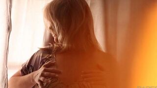 A sexy girl has a massage with a blanket covering her big boobs