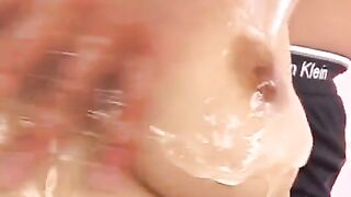 Hot Japanese chick with oil on her boobs, finger-fucking like a pro