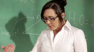 A girl is having fun with her teacher at her desk