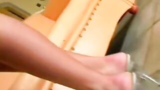 Beautiful woman masturbating on the leather chair, showcasing her amazing ass