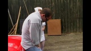 A nurse is having fun with a guy right in his car