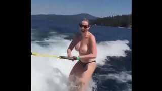 A girl has sex while skiing on the water surface