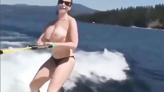 A girl has sex while skiing on the water surface