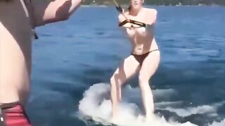A girl has sex while skiing on the water surface