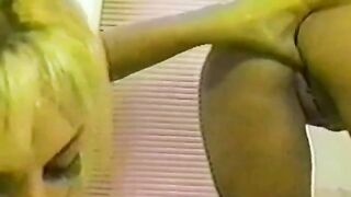 Girls have fun with each other in the shower using toys