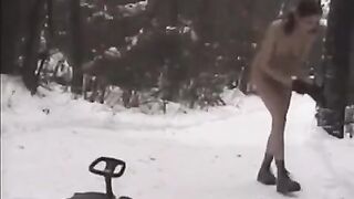 A lot of snow and naked girls playing snowballs on the street