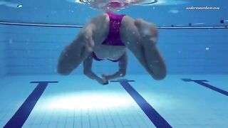 Nude beauty swimming in the pool is very exciting