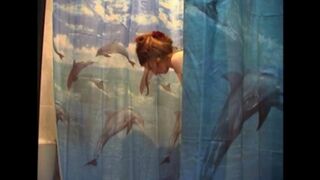 A man secretly shoots his naked wife in the bathroom using a camera