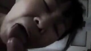 An Asian woman practices blowjob with her lover