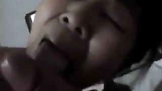 An Asian woman practices blowjob with her lover