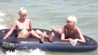 A naked girl is having fun on the beach with her boyfriend