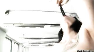 A girl in high heels masturbates and simulates sex with her fingers