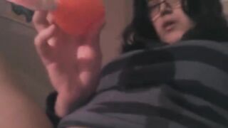 A hot brunette caresses her clitoris with a powerful vibrator