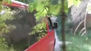A man squeezed the girl's tits near a car and fucked her