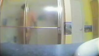 A girl has no idea that someone is watching her showering in the bath