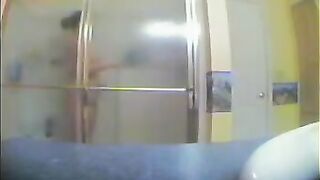 A girl has no idea that someone is watching her showering in the bath
