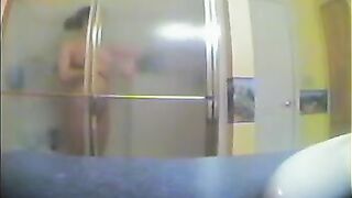 A girl has no idea that someone is watching her showering in the bath