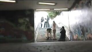 A woman in a state of undress has just been fucked on the street