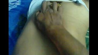 A husband massaged the nipples of his wife, exciting her with every touch