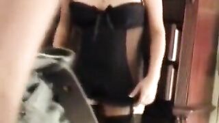 A wife in sexy lingerie is having fun with her husband in bed