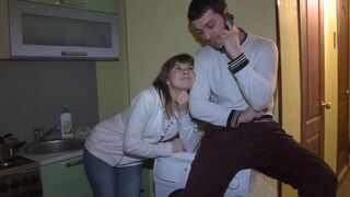 A wife is having fun in front of her husband