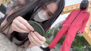 Asian woman plays a twisted version of Squid Game with her lover in a pool