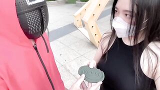 Asian woman plays a twisted version of Squid Game with her lover in a pool