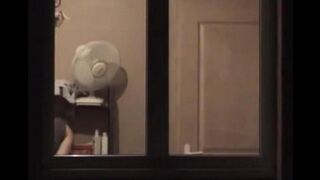 The guy admires himself in the mirror, completely naked