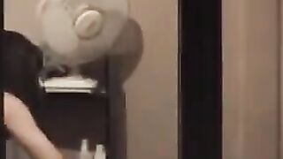 The guy admires himself in the mirror, completely naked