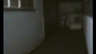 A fat woman is dancing on the bed in front of her husband