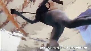 A girl is fucking with a guy in the swimming pool without any clothes